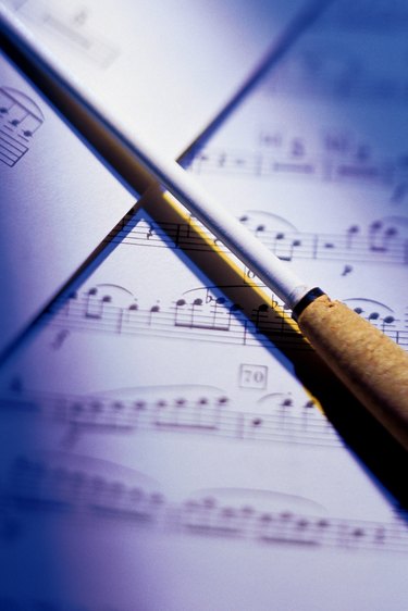 Conductor's baton on sheets of music