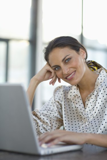 Businesswoman using laptop computer