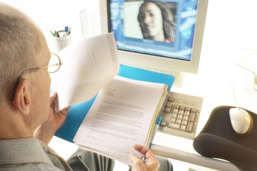 Businessman watching video conference