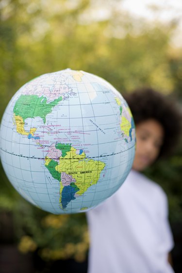 Boy holding globe