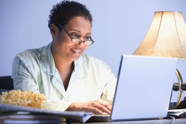 African businesswoman working in pajamas