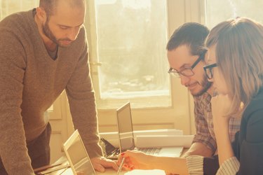 Young group of people/architects discussing business plans