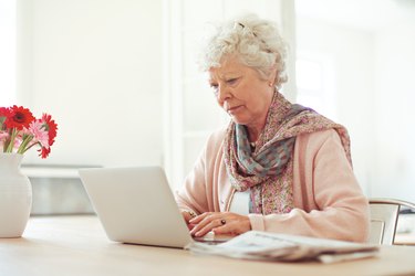Elderly Woman Typing Something
