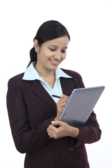 Young business woman with tablet and stylus
