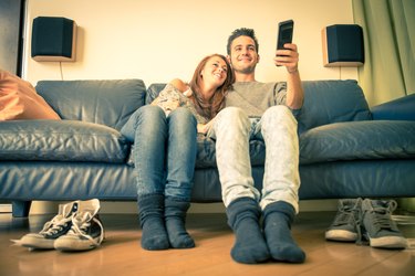 Couple of lovers watching tv