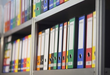 folders on bookshelf