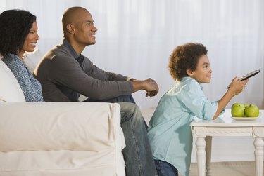 African family watching television