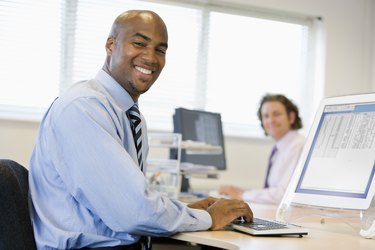 Businessmen working at desks