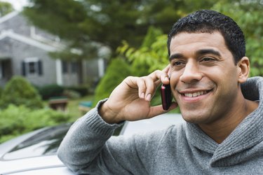 Man talking on a mobile phone and smiling