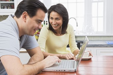 Couple using laptop