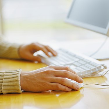 close-up of a person using a computer