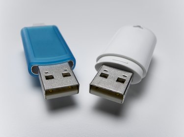 Blue and white USB flash drives, close-up (still life)