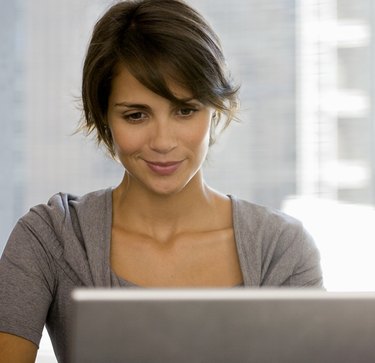 Businesswoman using laptop