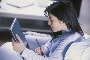 Woman using tablet computer