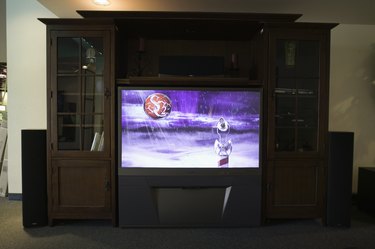 TV room with widescreen TV set in bookcase