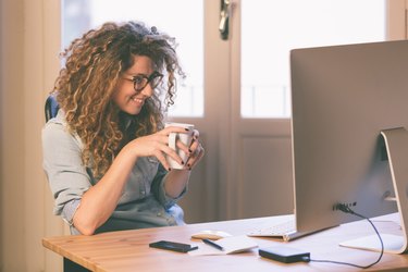 Young woman working at home or in a small office