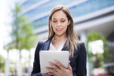 Business woman using a digital tablet