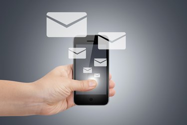 Hand with Smart Phone and Email Icons