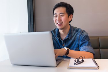 Asian handsome man in working space for creative jobs