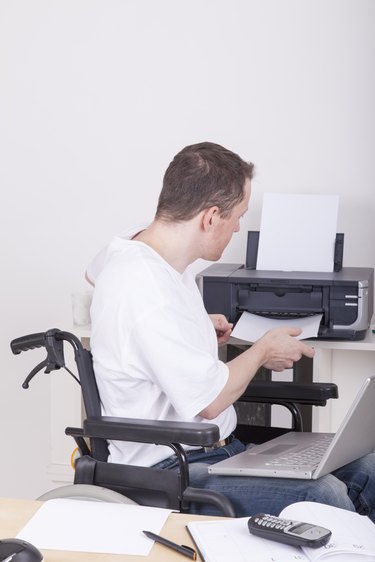 disabled man in wheelchair at work