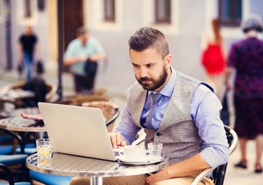 Hipster businessman in cafe