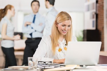 Business woman using laptop