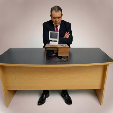 Businessman with Miniature Computer
