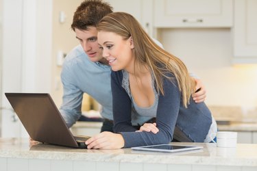 Man and woman chatting via webcam