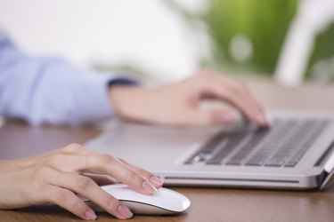 Close-up of working businesswoman - Stock Image