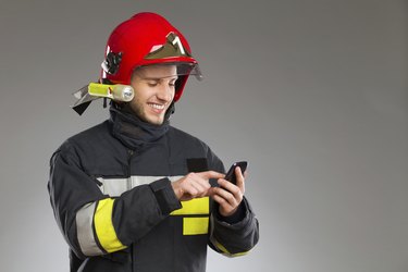 Firefighter using smart phone.