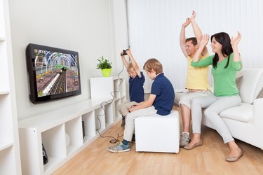 Young family playing video games