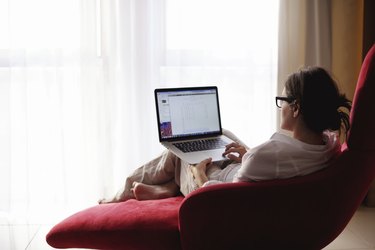 woman using a laptop computer at home