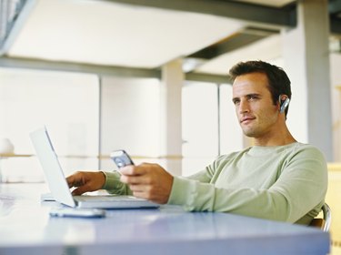 close-up of a businessman using a mobile phone