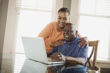 Couple using laptop