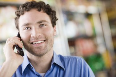 Man smiling on cell phone