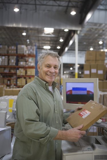 Cheerful man working in distribution warehouse