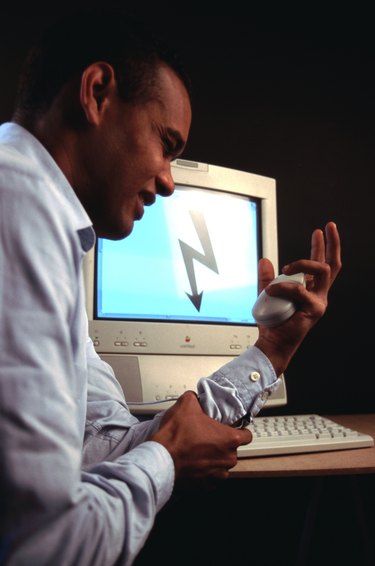 Businessman holding mouse checking nerves