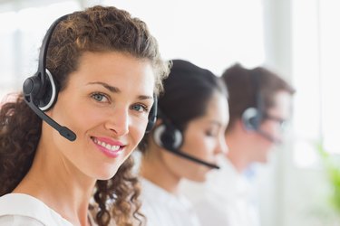 Beautiful businesswoman wearing headset