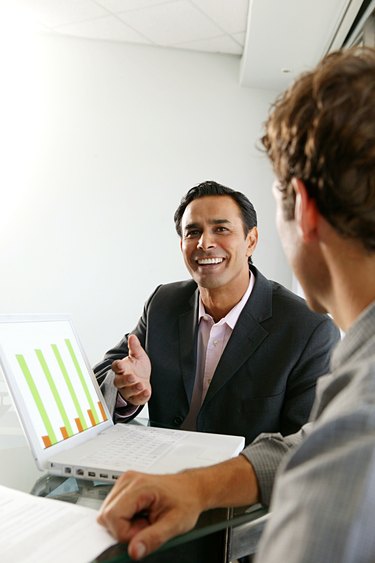 Man making presentation to colleague