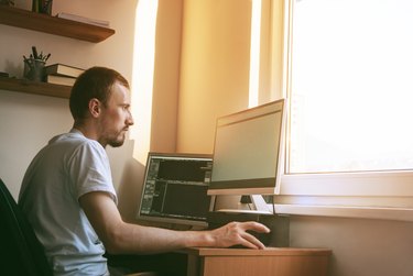 man working at home office computer