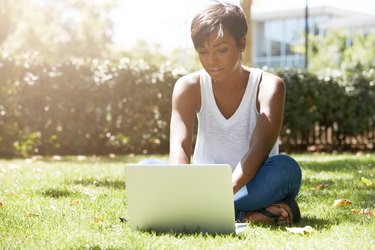 Young attractive dark-skinned college student wearing tank top