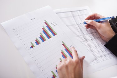 Woman working with bar graphs