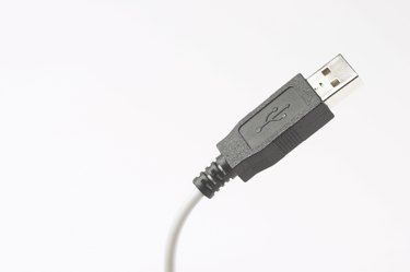 Black and white studio shot of usb plug and cord