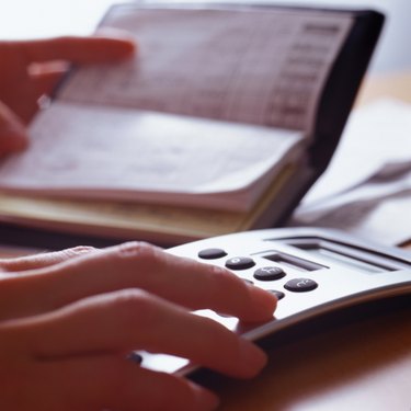 Woman Balancing Checkbook