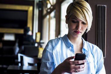 Young woman in a cafe chatting