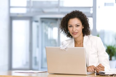Smiling Businesswoman With Laptop