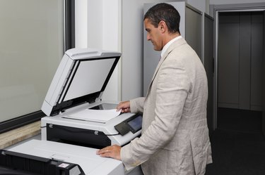 Businessman doing a photocopy