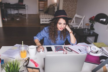 Designer working on her new project from home office