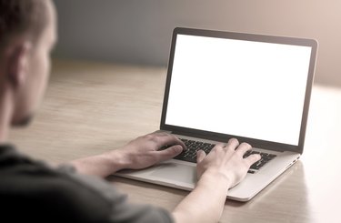Man using laptop computer.
