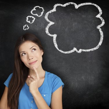 Woman thinking blackboard